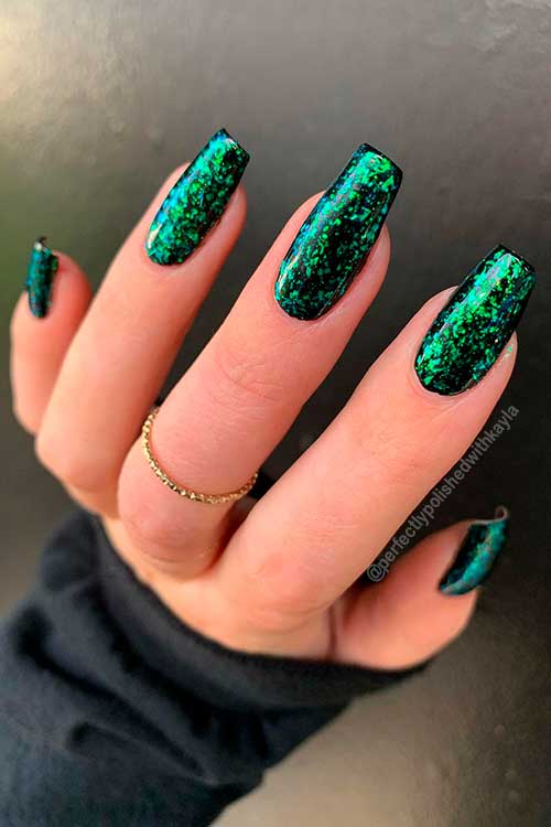 Glittering Christmas Nails with Dark Green Nail Polish Long Coffin Christmas Nails with Dark Green Glitter for Christmas Celebration