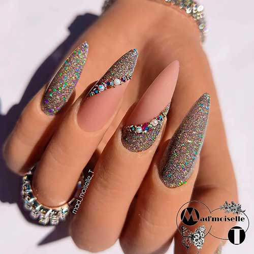 Magnificent Long Glitter Winter Nails 2022 with Rhinestones and Matte Nude Base Color on Two Accents