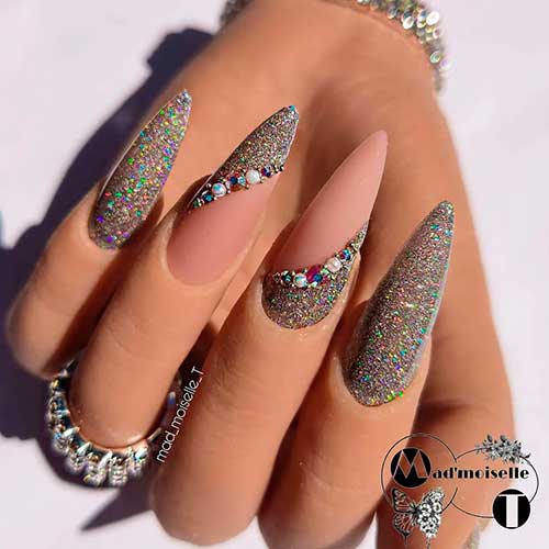 Magnificent Long Glitter Winter Nails with Rhinestones and Matte Nude Base Color on Two Accents