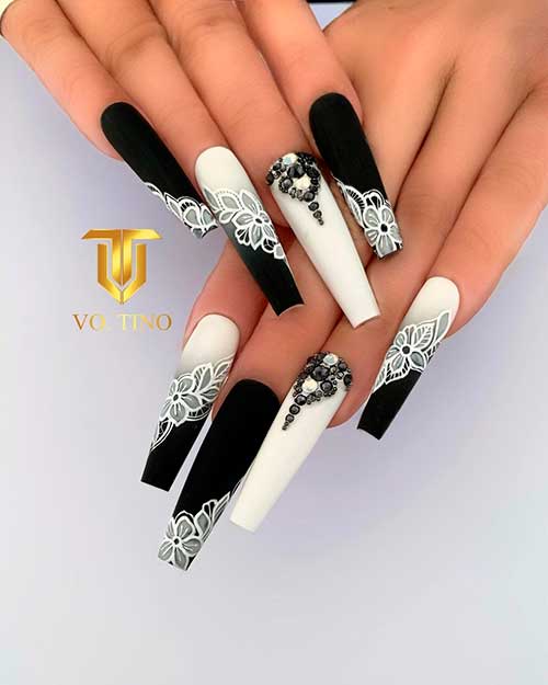 Long Matte Coffin Black And White Nail Design with White Floral Nail Art and Rhinestones