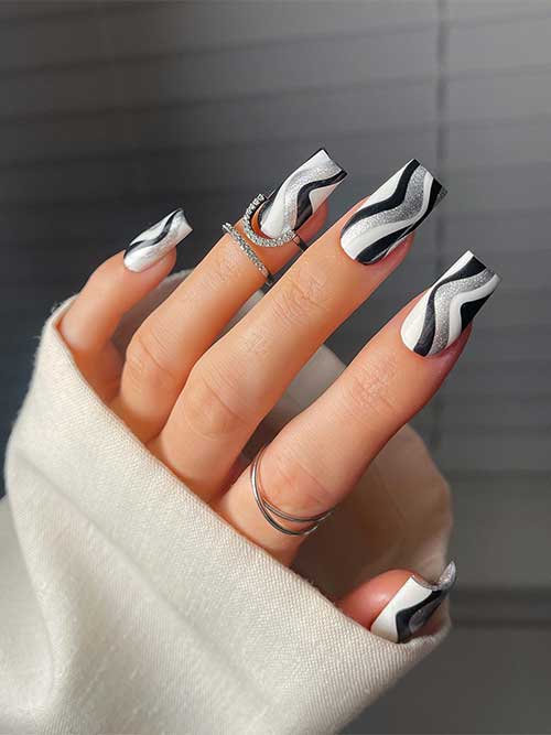 Medium square shaped black and white with silver glitter swirl nails Medium square shaped black and white with silver glitter swirl nails