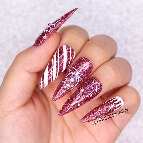 Long Glitter Pink Stiletto Christmas Nails with Snowflake, candy cane, and Christmas ball Nail Art Design