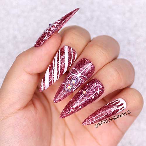 Pink Stiletto Nail Polish Design Long Glitter Pink Stiletto Christmas Nails with Snowflake, candy cane, and Christmas ball Nail Art Design