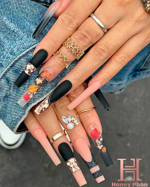 Long Coffin Shaped Matte Black and Nude Nails With Fall Leaves and Gold Glitter