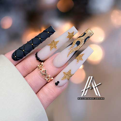 Long Coffin Black and White Nails with Rhinestones, Gold Glitter, and Gold Glittery Stars Long Coffin Black and White Nails with Rhinestones, Gold Glitter, and Gold Glittery Stars