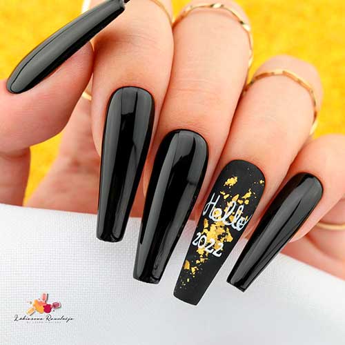 Long glossy coffin new years eve nails with gold patches and hello 2022 words on matte black accent Long glossy coffin new years eve nails with gold patches and hello 2022 words on matte black accent