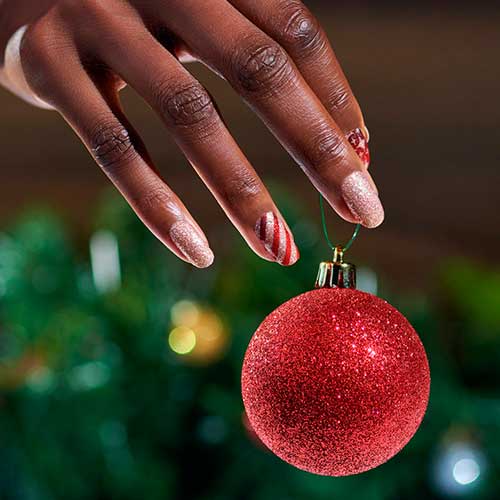 Wrap It Up Color Street Nails Wrap It Up Color Street Nails Consists of Gold Glitter Nails, Snowflake Nails, and Candy cane Accent