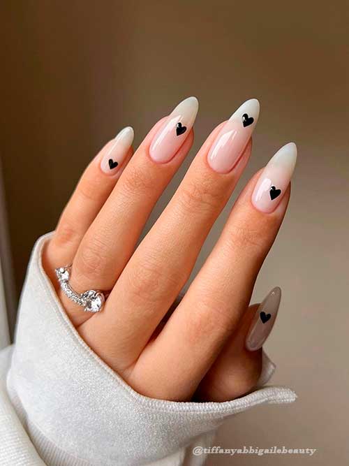 Long Almond White Gel valentines day nails 2022 with a Black Heart over each nail Long Almond White Gel valentines day nails 2022 with a Black Heart over each nail