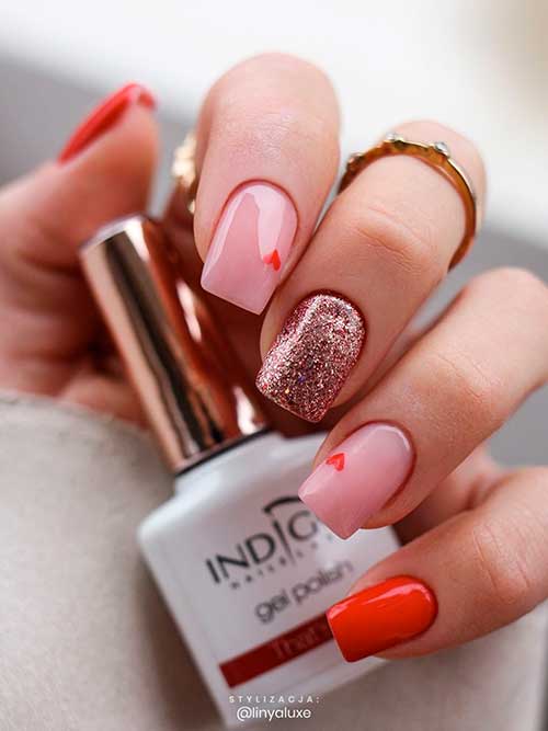 Square red valentines day nails Square red valentines day nails with nude and glitter accents and two tiny red hearts design
