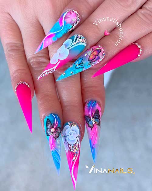 Colorful Stiletto Spring Nails with Butterflies, White Flowers, and Rhinestones