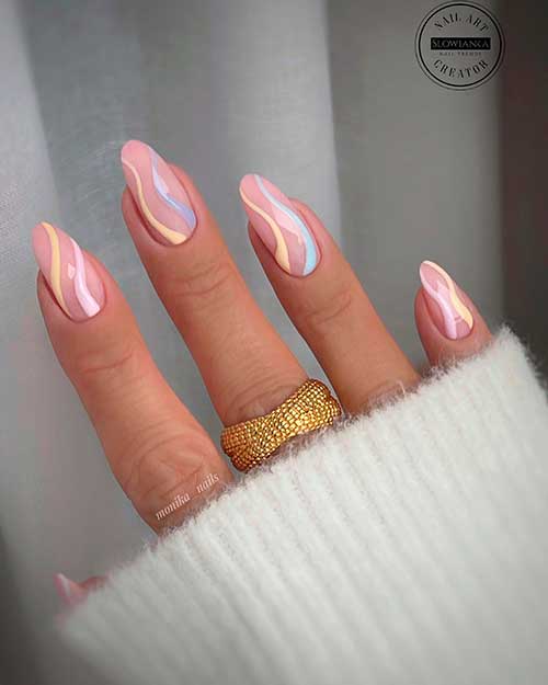 Long almond pastel swirl nails with nude base color design for spring 2022
