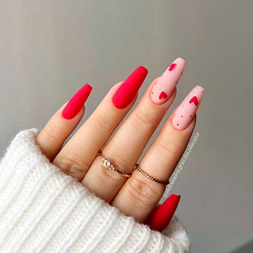 Long matte red valentine’s coffin nails 2023 with red hearts and dots on nude pink accent nails
