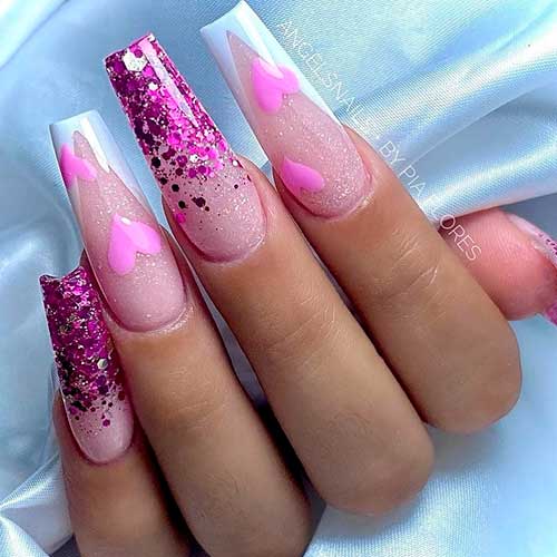 sparkling Valentine’s coffin nails Long sparkling Valentine’s coffin nails 2023 with glitter, white French tips, and pink hearts