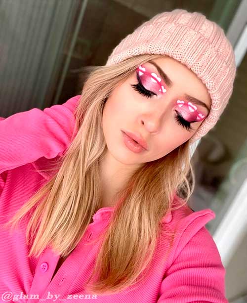 One of the cutest Pink Glow Valentines Makeup Looks with Three Big White Hearts