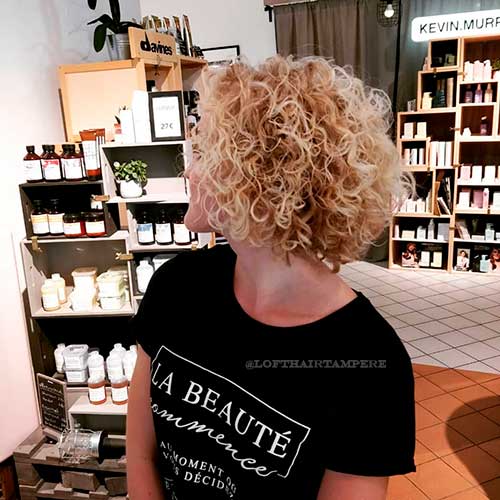 Blond permanent cute curls with short permed bob haircut