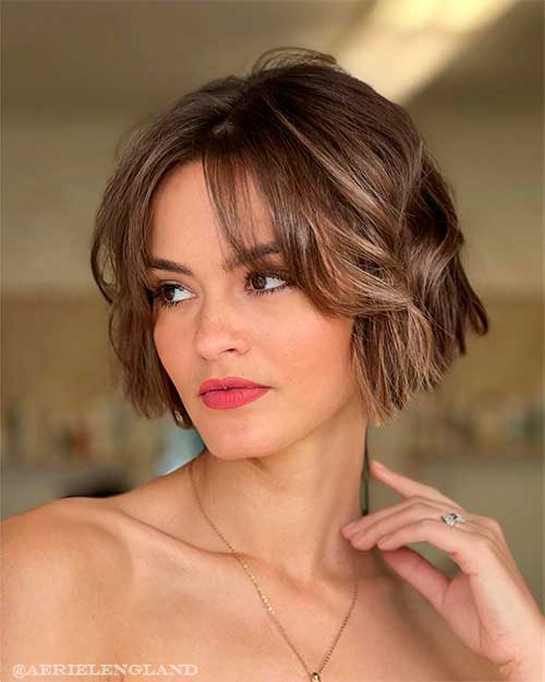 Classic French bob paired with a chin length crop and bangs