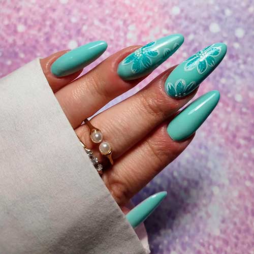 Dusty aqua nails with two accent flower nails design Dusty aqua nails with two accent flower nails design