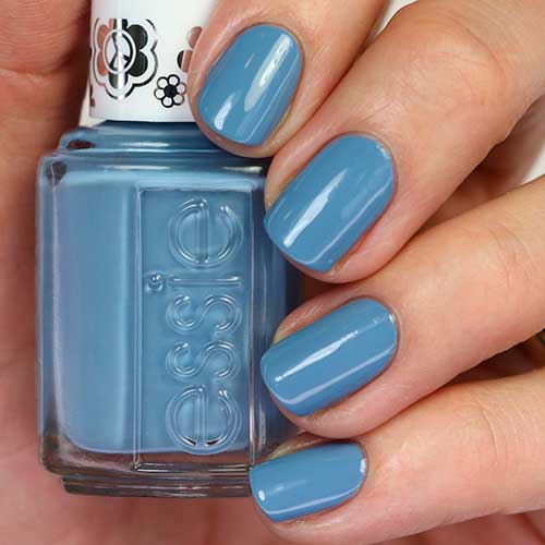 Short muted denim blue nails uses Essie Nail Polish Flare For Fun from the Essie Movin’ & Groovin’ Collection