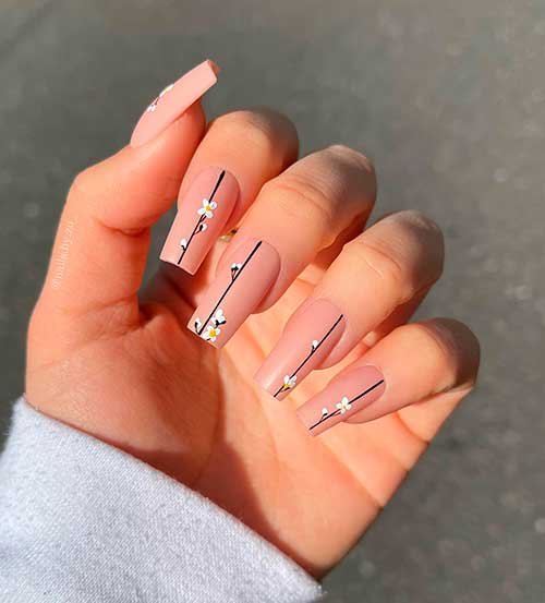 Hand-Painted White Flower Nails on Nude Acrylics Hand-Painted White Flower Nails on Square Shaped Nude Acrylics