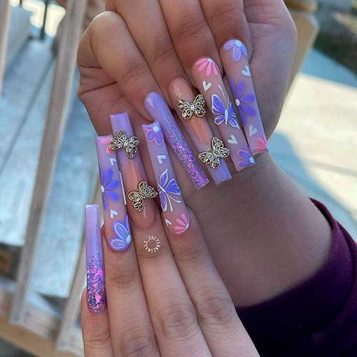 Light purple, pink, and glitter coffin shaped flower and butterfly nails design