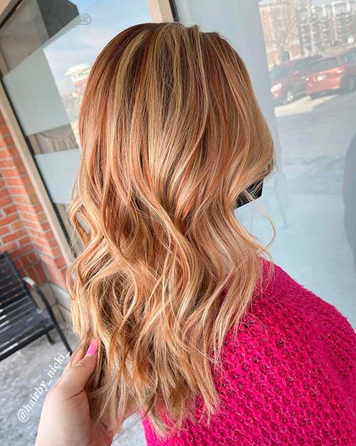 Long Hair Dyed with Strawberry Blonde Hair Color which is one of the cutest spring hair colors to try