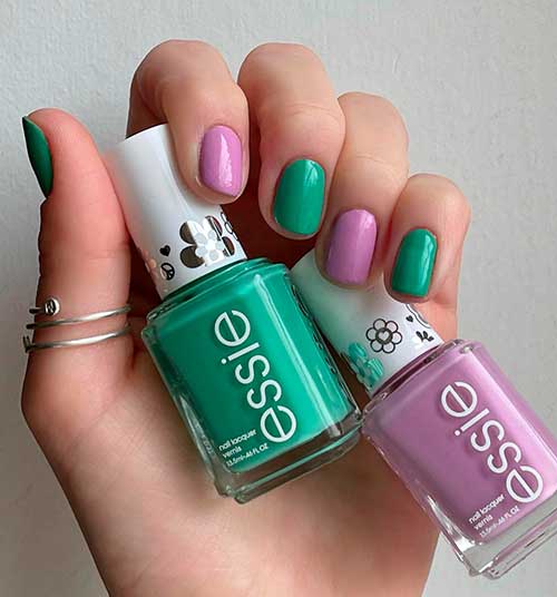 Short dark mint green and soft purple nails uses Along For The Vibe and Run Wildflower Essie nail polishes