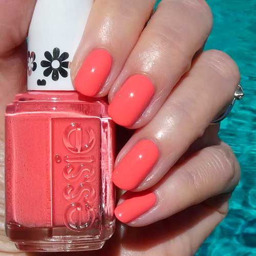 Short vibrant pink nails with "Love yourself to peaces" Essie nail polish