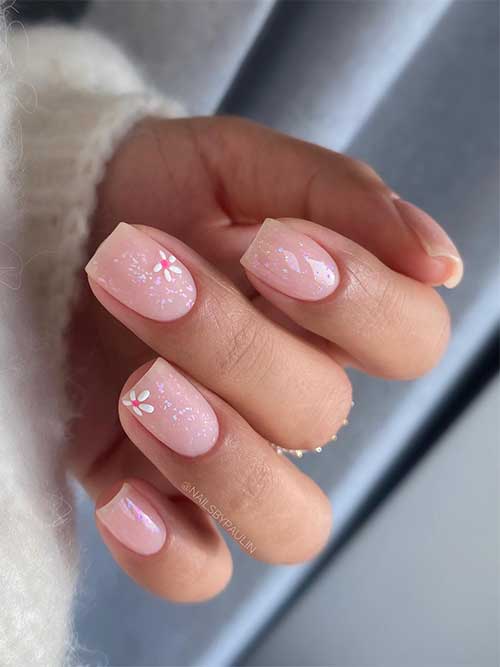 Short square-shaped glitter nude spring nails 2023 with tiny daisy flowers