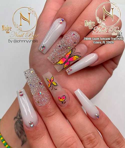 Sparkling Light Grey Nails with Butterflies Sparkling Coffin Light Grey Nails with Butterflies, Rhinestones, and Glitter Accent