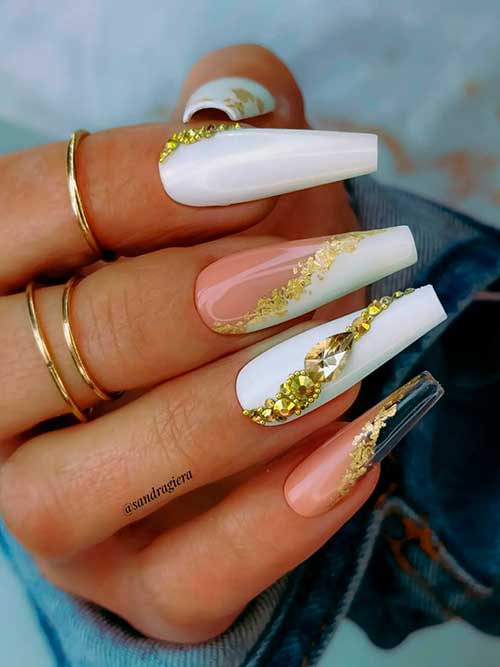 Glossy White Coffin Nails with Gold Decorations Glossy White Coffin Nails with Gold Decorations and Accent Diagonal French Nails with Gold Glitter