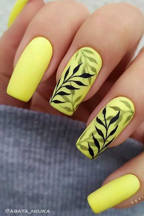 Long Square Shaped Matte Yellow Summer Nails Design with Black Leaf Nail Art on Two Accents