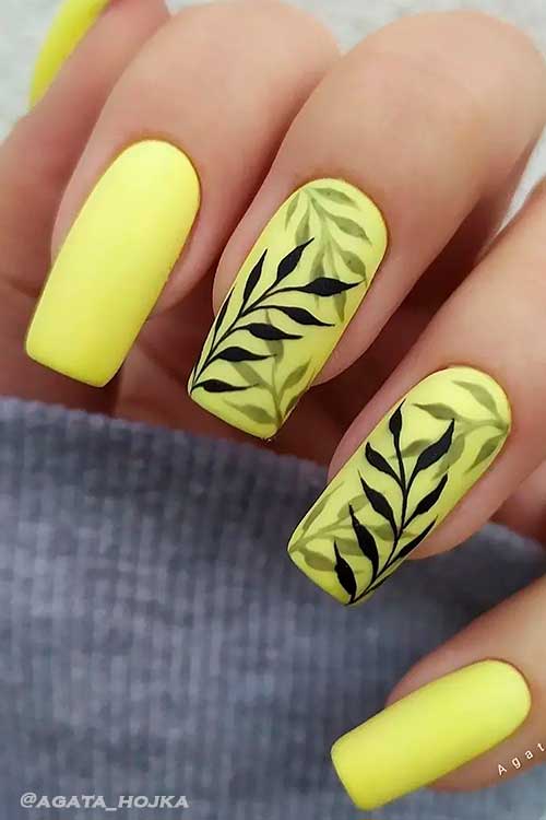 Matte Yellow Summer Nails Design Long Square Shaped Matte Yellow Summer Nails Design with Black Leaf Nail Art on Two Accents