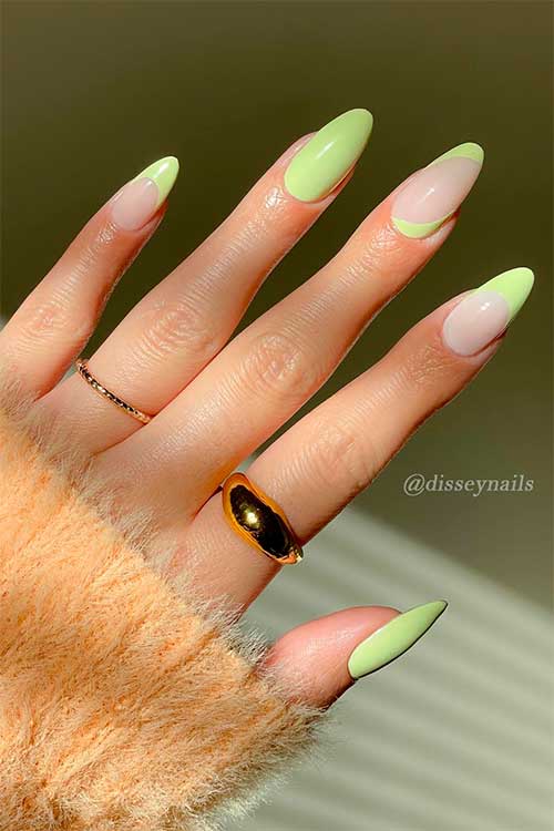 Medium almond shaped matcha light green nails use OPI The Pass is Always Greener from Xbox collection Medium almond-shaped matcha light green French nails use the Pass is Always Greener from the OPI Xbox collection