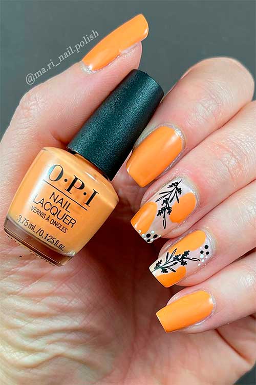 Medium coffin shaped orange nails with leaf nail art use Trading Paint from OPI Xbox spring nail colors 2022 Collection