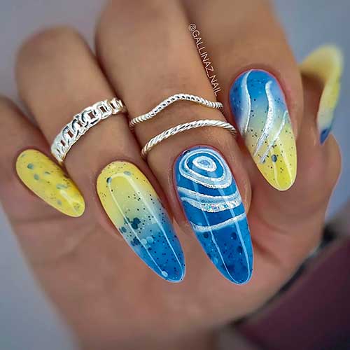 Sand and Sea Ombre Nails with Glitter and Swirls Long Almond Shaped Yellow and Blue Ombre Nails with Glitter and Swirls