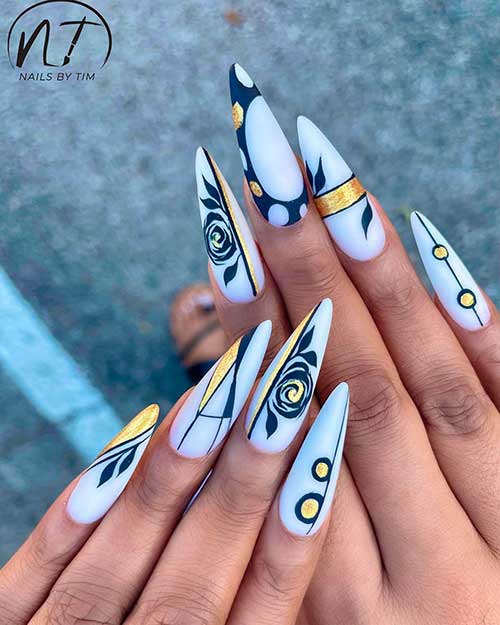 Long White Nails with Black Abstract and Leaf Nail Art with Gold Touches