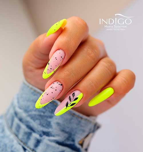 Long Almond Yellow Neon French Nails with Black Speckles and A Black Leaf on Accent for Summer 2022