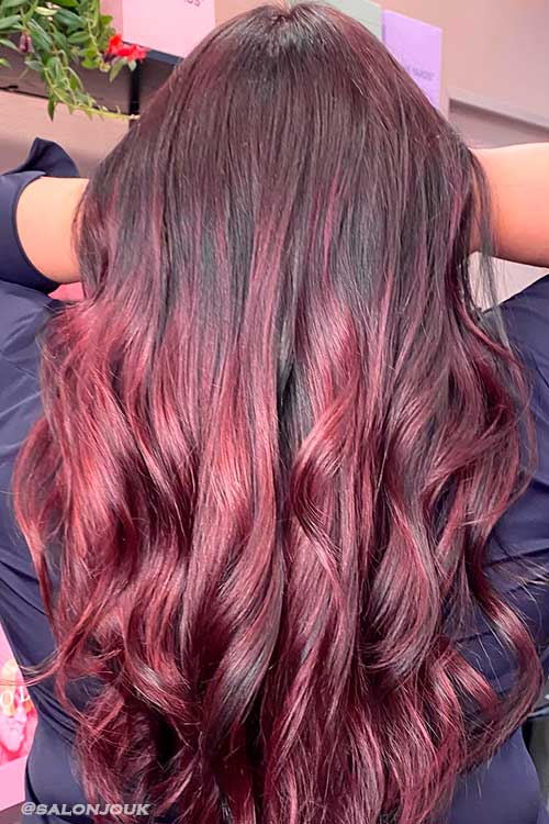 Long Wavy Aubergine Hair Color is One of the Summer Hair Colors 2022 to Try