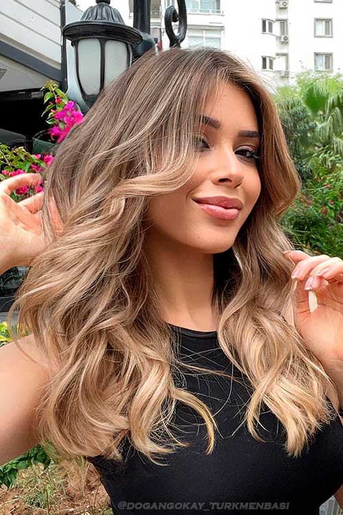 Blonde balayage highlights on brown hair for Summer 2022
