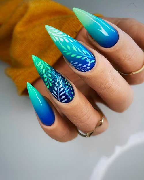 Long Stiletto Blue and Mint Green Ombre Nail Design with Leaf Nail Art on Two Accents