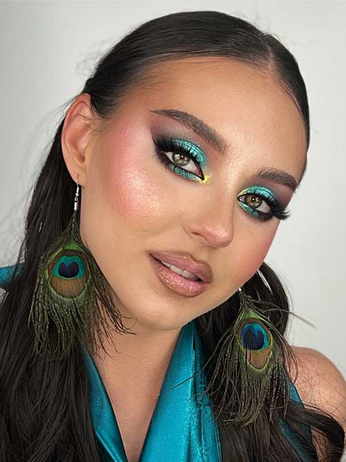 Bold summer makeup showcasing turquoise eyes, yellow accents, fluttery lashes, and a sleek deep nude lip for sophistication. Bold summer makeup showcasing turquoise eyes, yellow accents, fluttery lashes, and a sleek deep nude lip for sophistication.