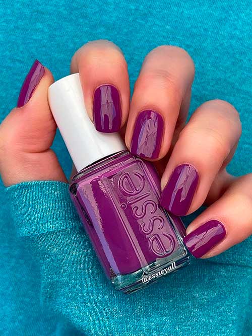 Essie Set The Tiki Bar High Which Is A Vibrant Purple Nail Polish With Red Undertones From Summer 2022 Collection