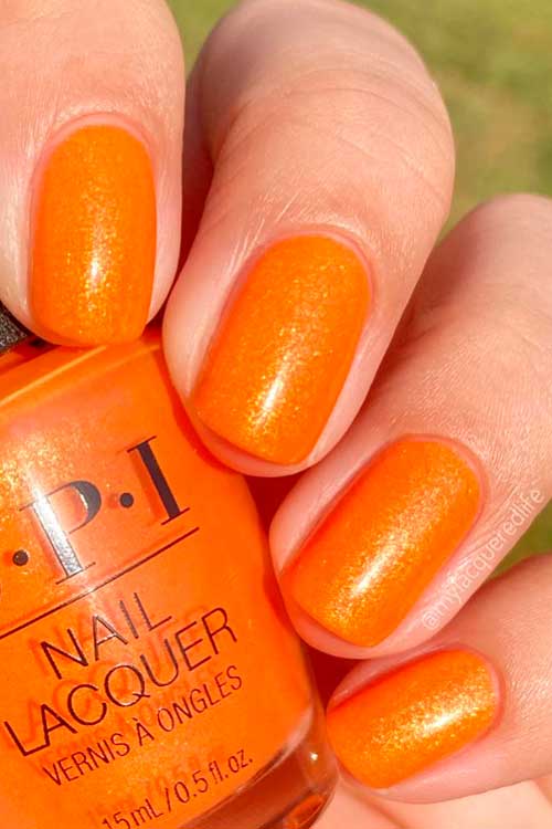 Short shimmer orange nails use OPI Mango for It from OPI Summer Nail Colors 2022 Collection – Power of Hue