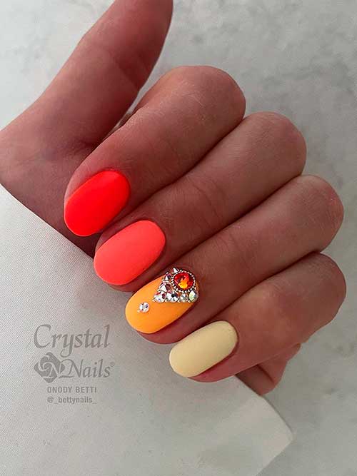 Multicolored Neon Orange Nails Multicolored Matte Neon Orange Nails with with Beige and Yellow Accents and Adorned with Rhinestones