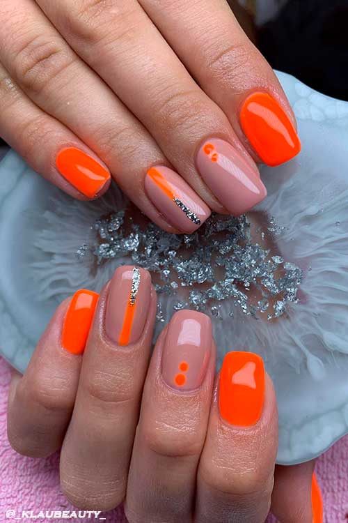 Neon Orange and Nude Nail Art Design with Glitter Touches