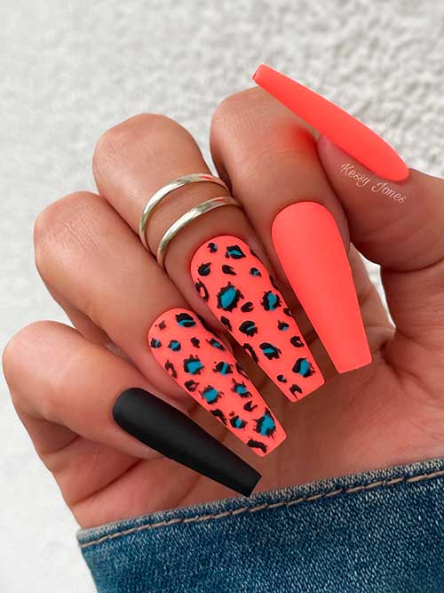 Matte Neon Orange with Black and Blue Leopard Prints on Two Nails Besides One Matte Black Nail