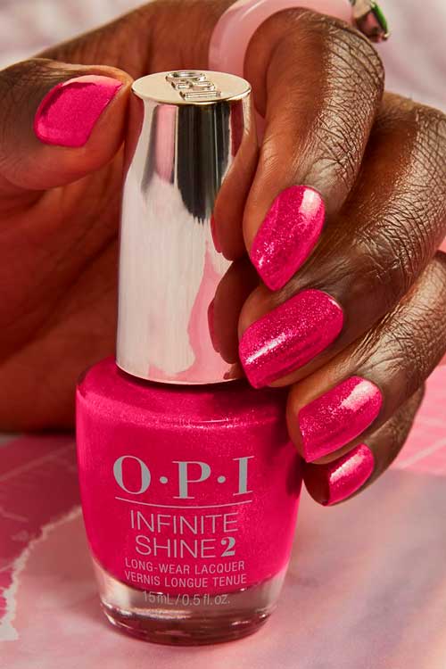 Short shimmer pink nails use OPI Pink BIG from OPI Summer Nail Colors 2022 Collection – Power of Hue