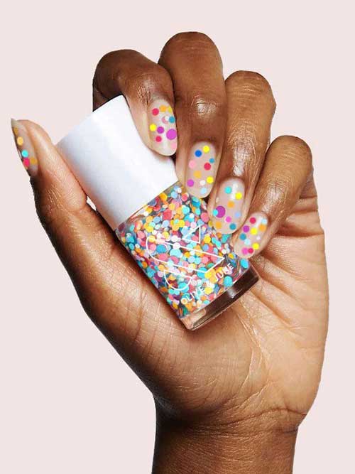 A rainbow confetti polish in a clear base to add a little sweetness and fun to all your nails