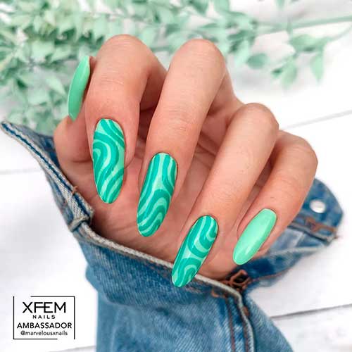 Long Round Shaped Green Swirl Nails on Mint Green Base Color for spring and summer times