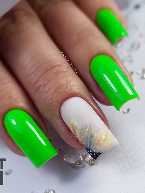 Long square shaped neon green nails with a pastel yellow floral nail art on an accent matte milky white nail